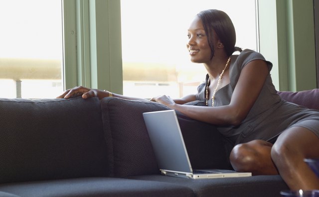 African businesswoman sitting on sofa