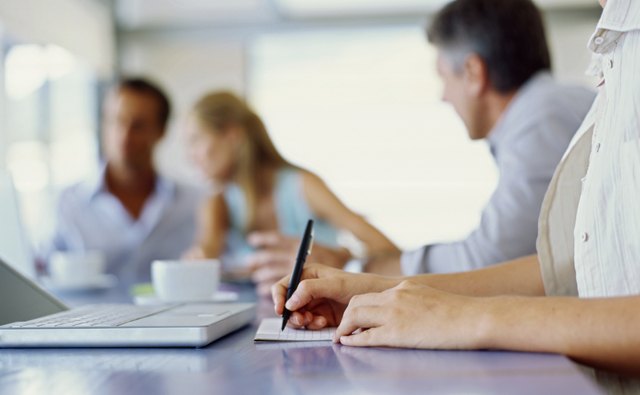 business executives discussing work in an office