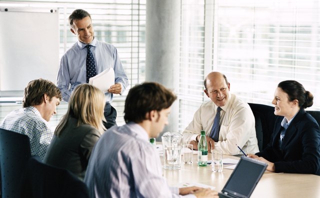 CEO With His Business Executive Team in a Boardroom Meeting