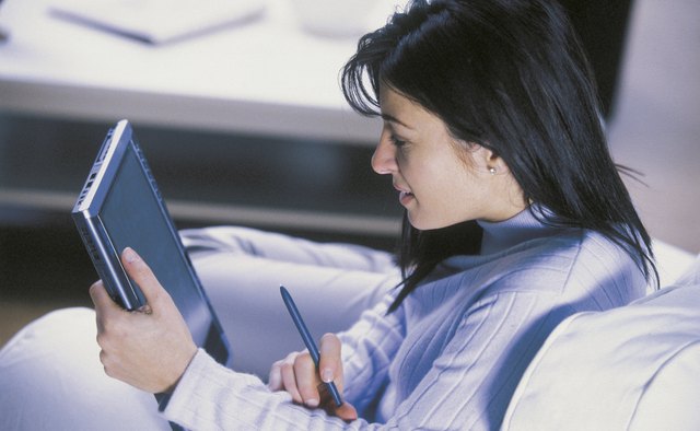 Woman using tablet computer