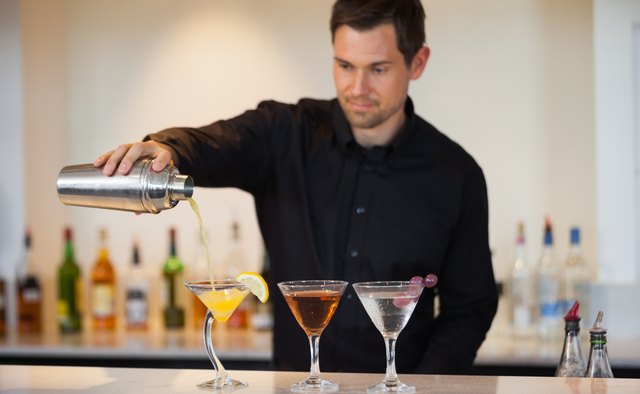 Bartender pouring cocktails