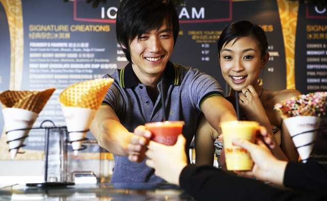 Man and woman getting beverages at retail store