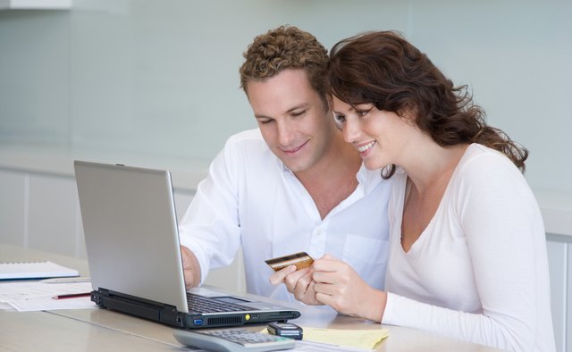 A couple paying bills online