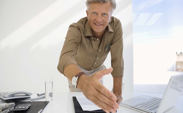 Businessman greeting with handshake