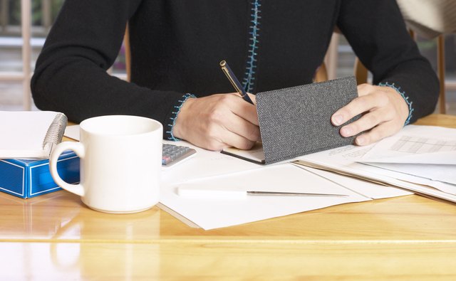 Woman writing a check