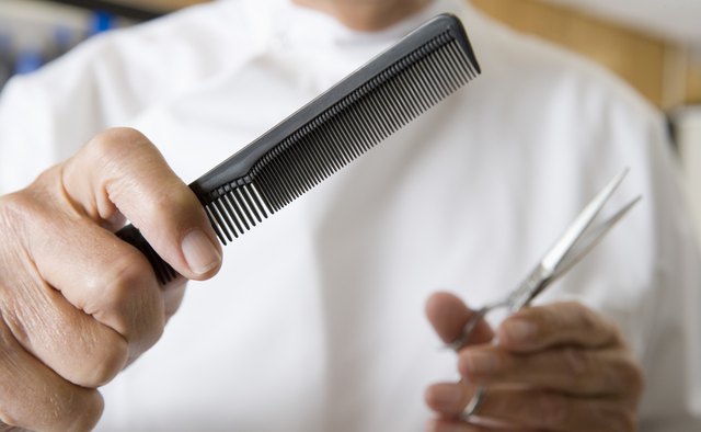 Barber with scissors and comb