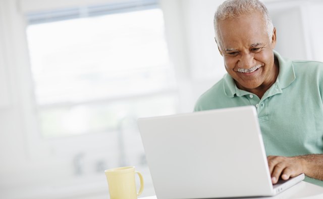 40 year old man looking at bank accounts online