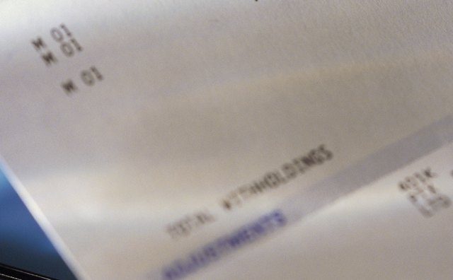 Pay check stub showing taxes withheld