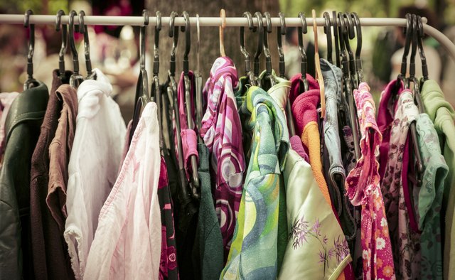 clothes on a rack on a flea market