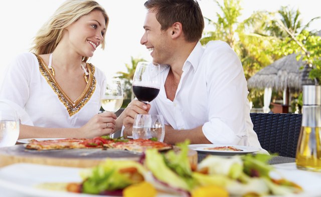 Couple Enjoying Meal In Outdoor Restaurant