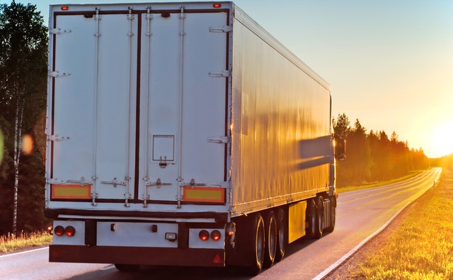 Truck on a road in the evening