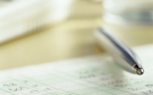 Close-up of a Ledger and Pen