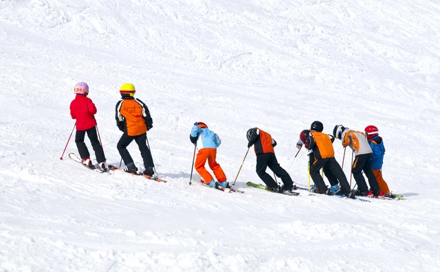 Children practicing ski