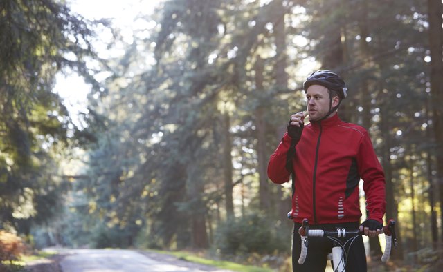 Cyclist eating energy bar