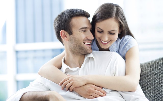 Couple hugging at home