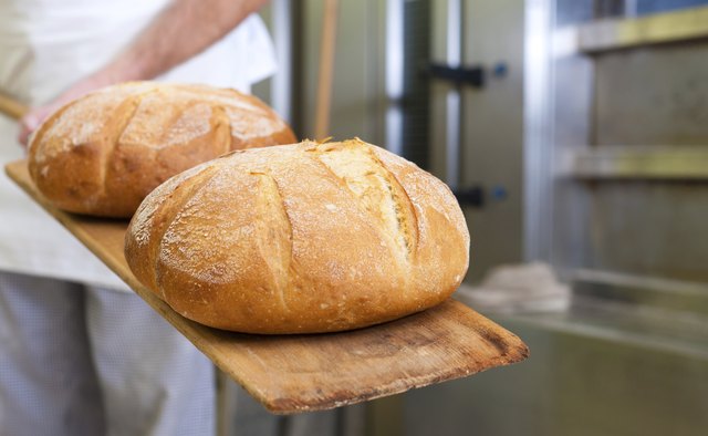 Male baker baking bread
