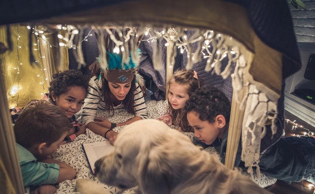 Reading children stories in a tent at home!
