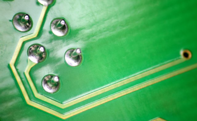 Wave soldering machines can process batches of circuit boards.