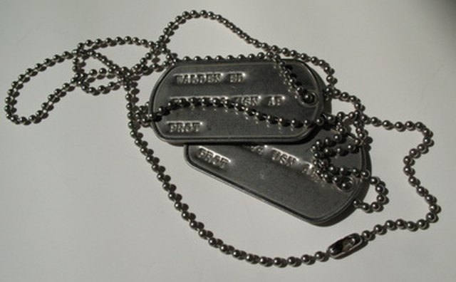 Military dog tags are worn by men and women in the armed services.