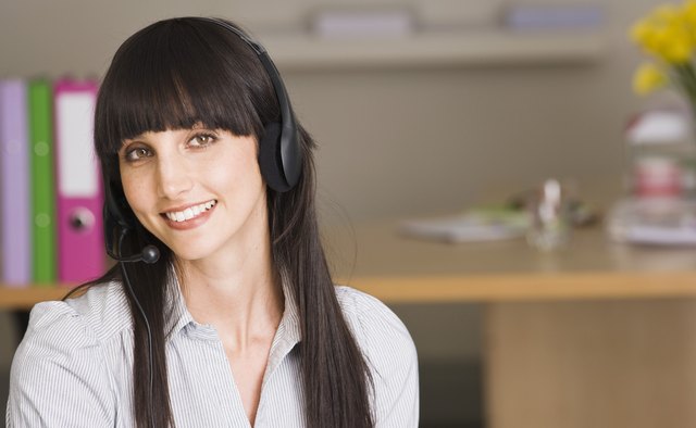 Businesswoman smiling with headset