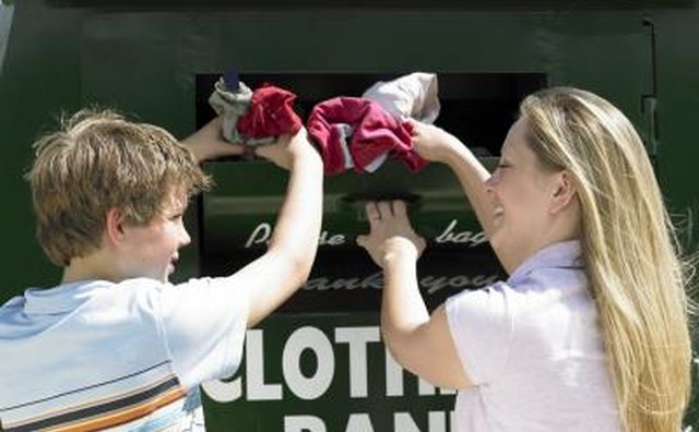 Mother and son donating clothing.