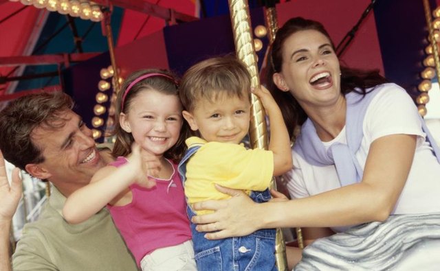 A family on a ride at a fair.