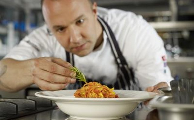Chef add garnish to entrée