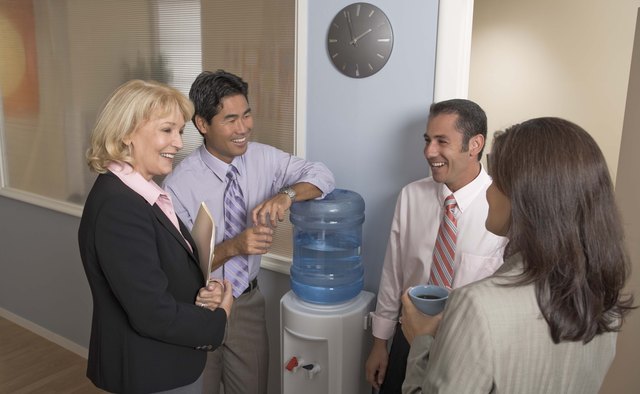 Businesspeople gathering at water cooler