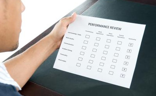 An employee reviewing an excellent performance review