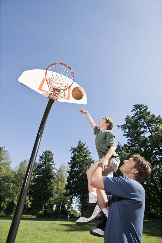 Father and son playing basketball