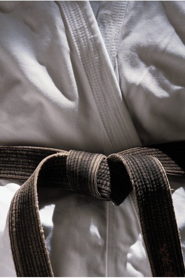 Martial arts gi with black belt