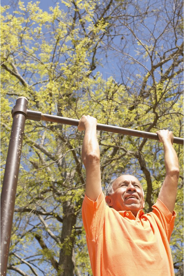 Man doing pull-ups outdoors