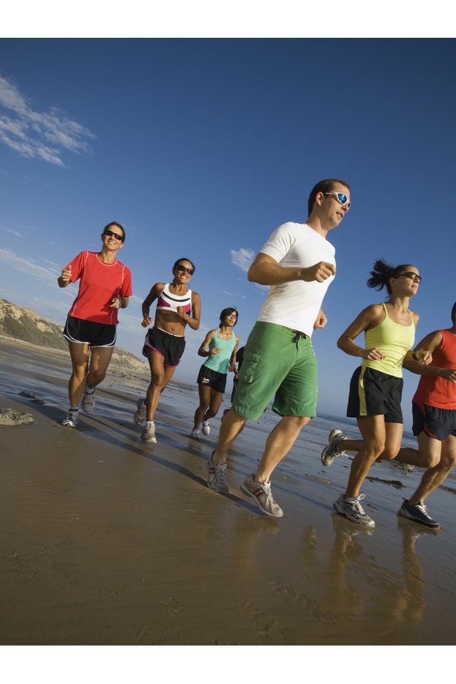 Multi-ethnic runners racing at beach