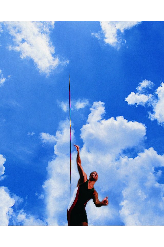 Javelin thrower in front of dramatic clouds