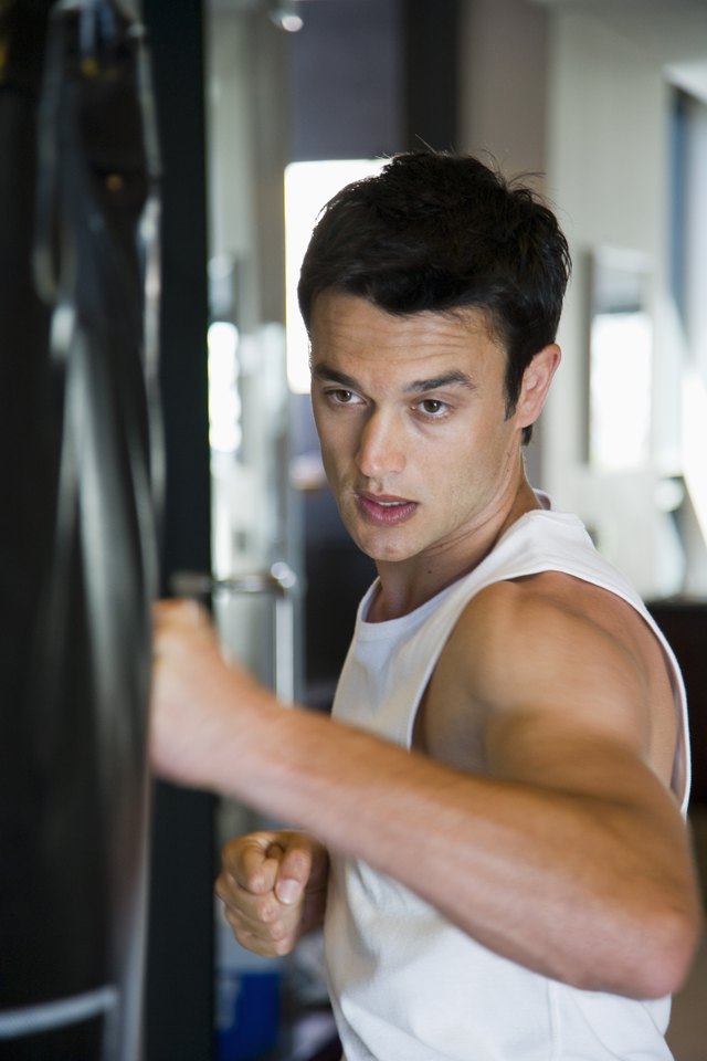 Man punching heavy bag