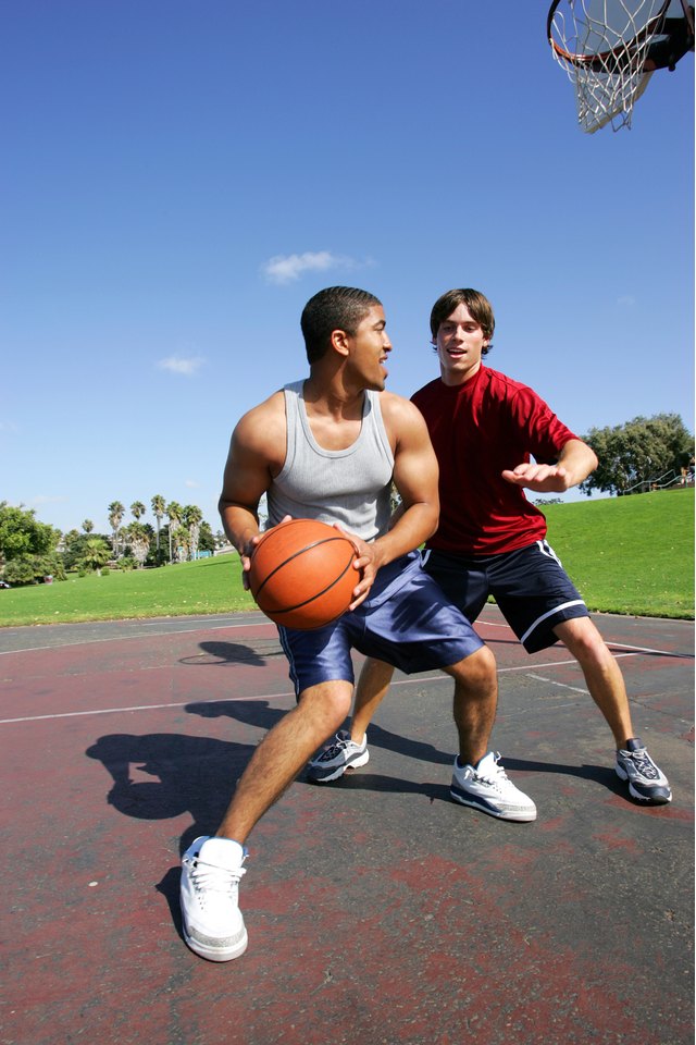 Men playing basketball