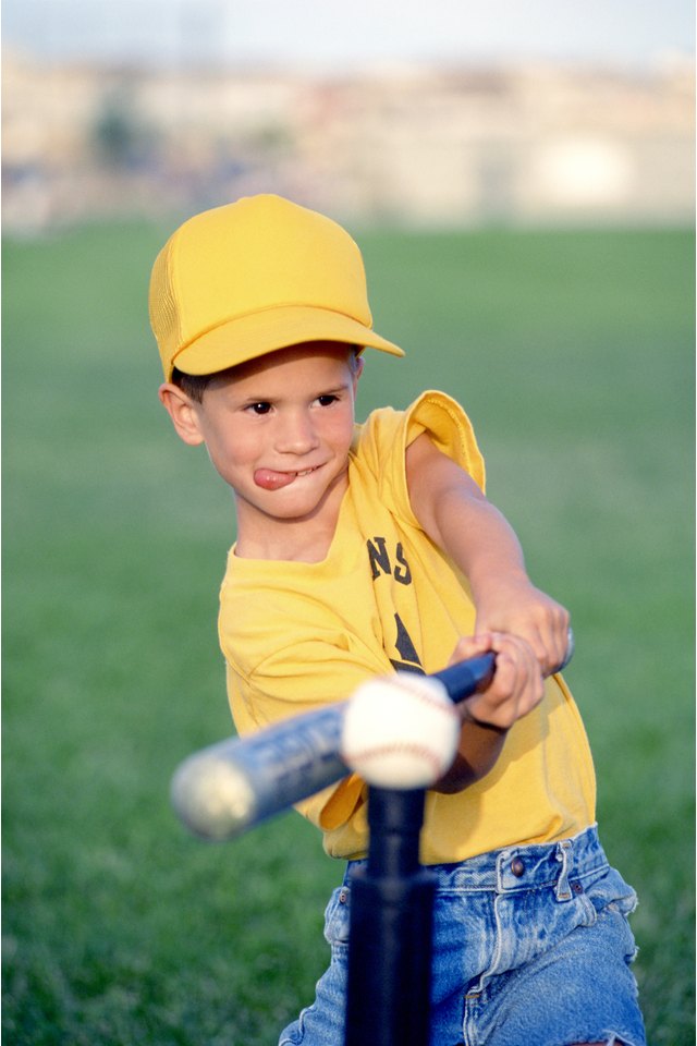 Boy hitting tee-ball