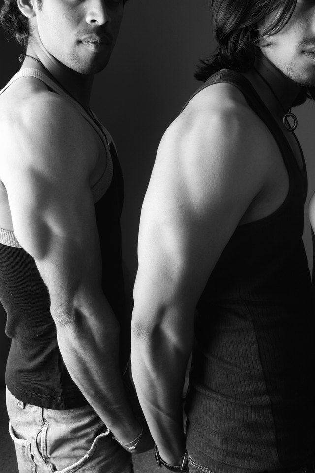 Portrait of two models showing off their muscles