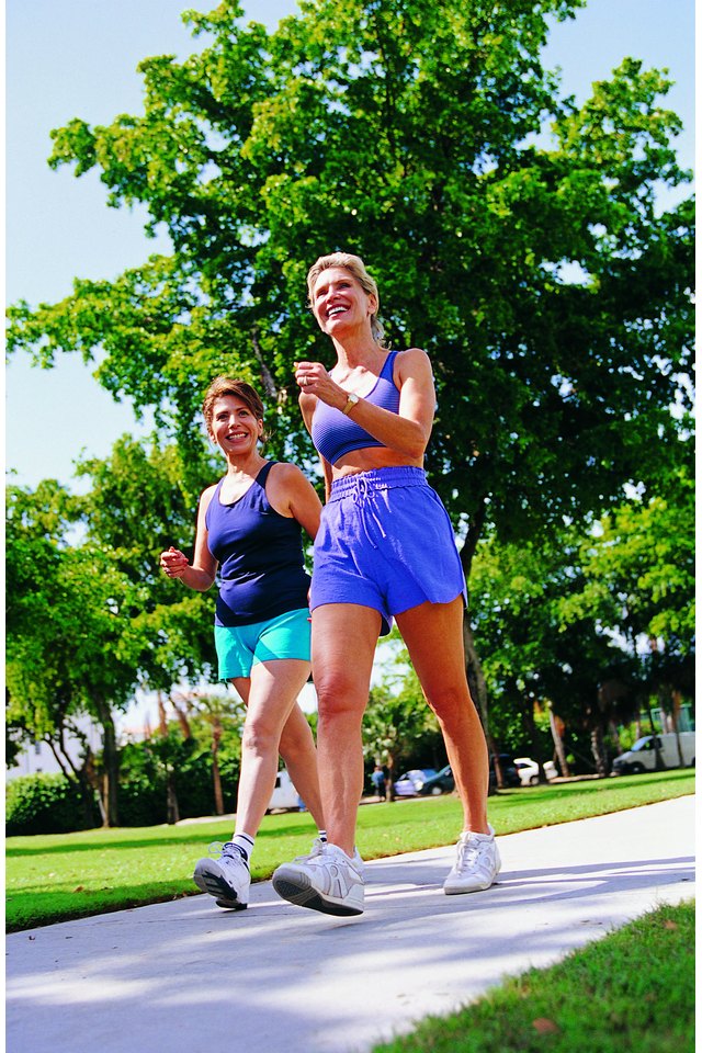 Two women power walking