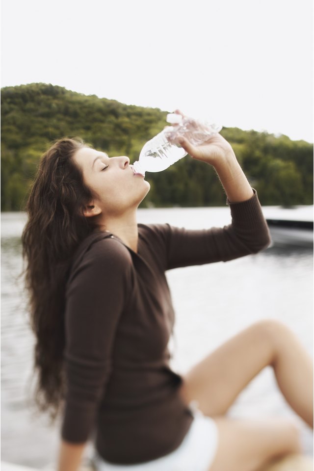 Teenage girl drinking water