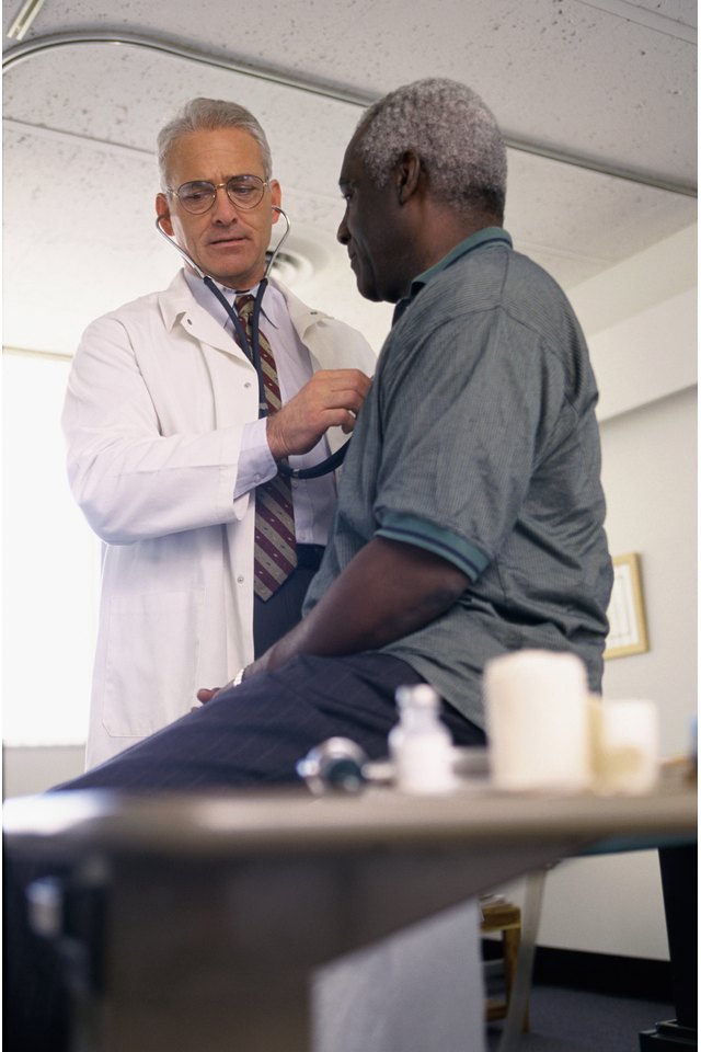 Male doctor examining a male patient