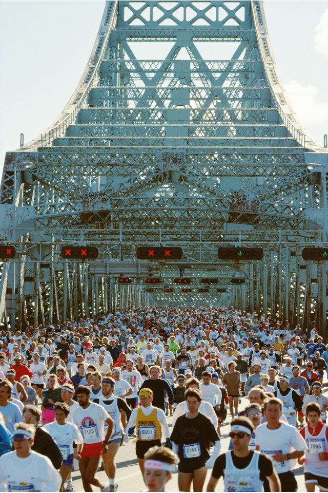 People on Jacques Cartier Bridge in Montreal running marathon