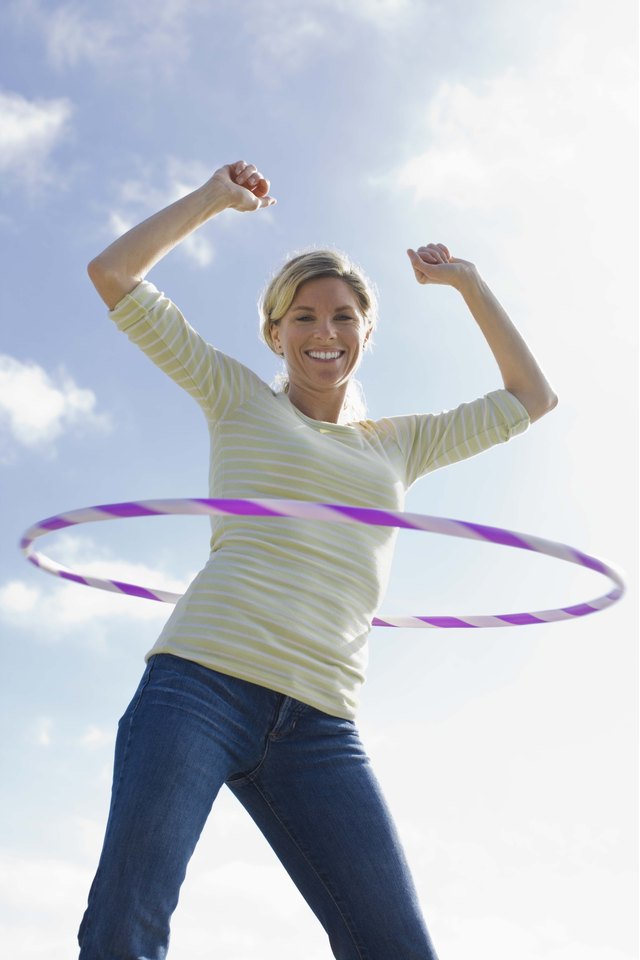 Woman with a plastic hoop toy