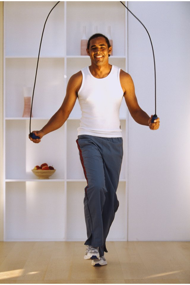 Portrait of a young man using a skipping rope