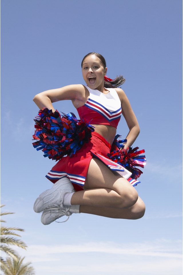 Cheerleader Holding Pompoms, Jumping and Cheering