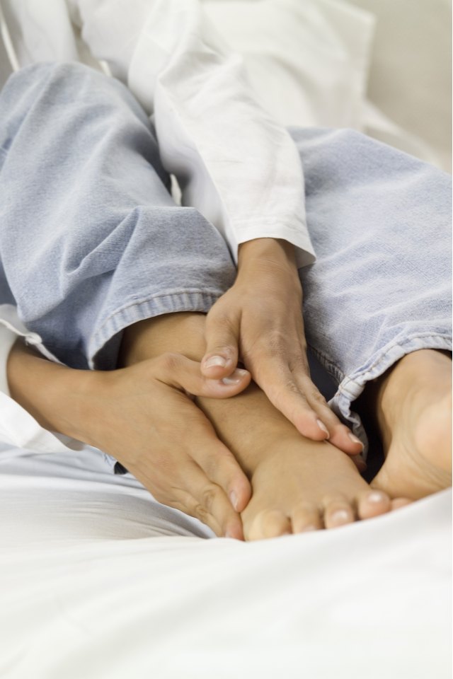 A person massaging their foot
