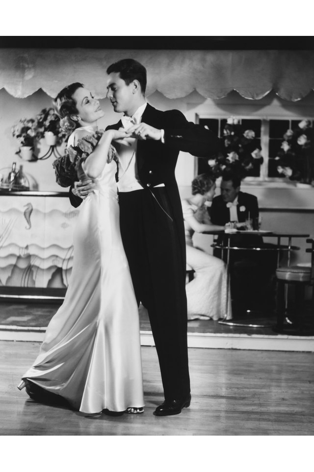 Couple in evening wear dancing