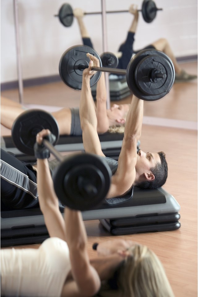 Man lifting weights in exercise class