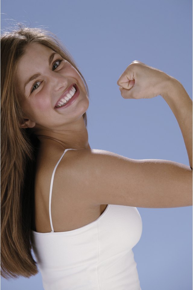 Woman flexing bicep