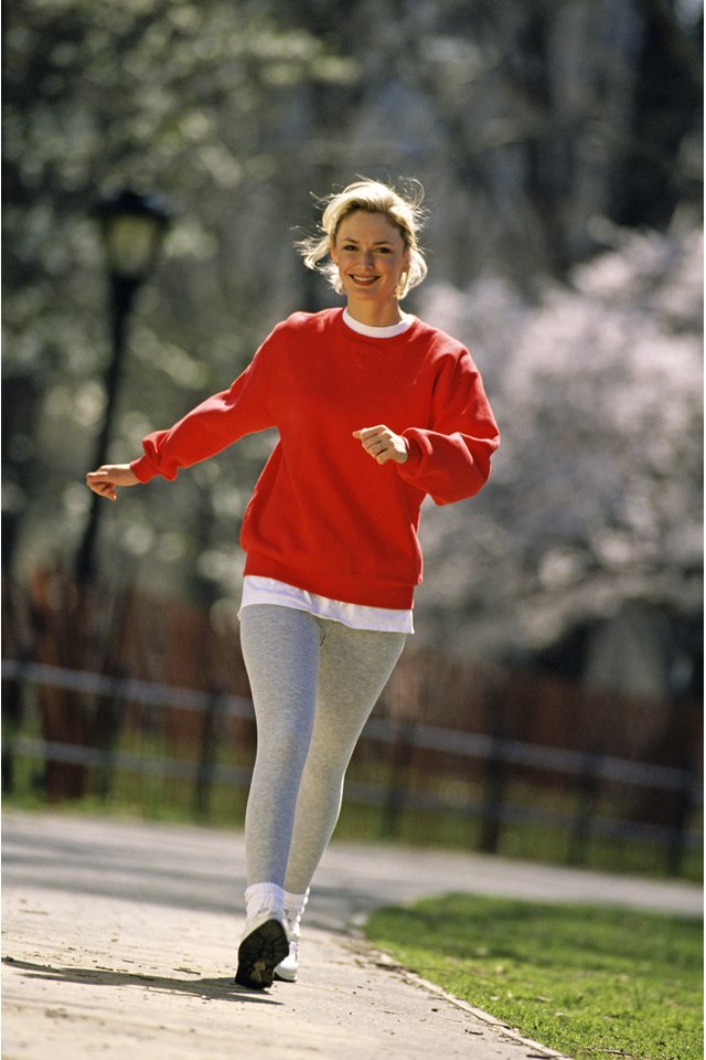 Woman walking along path